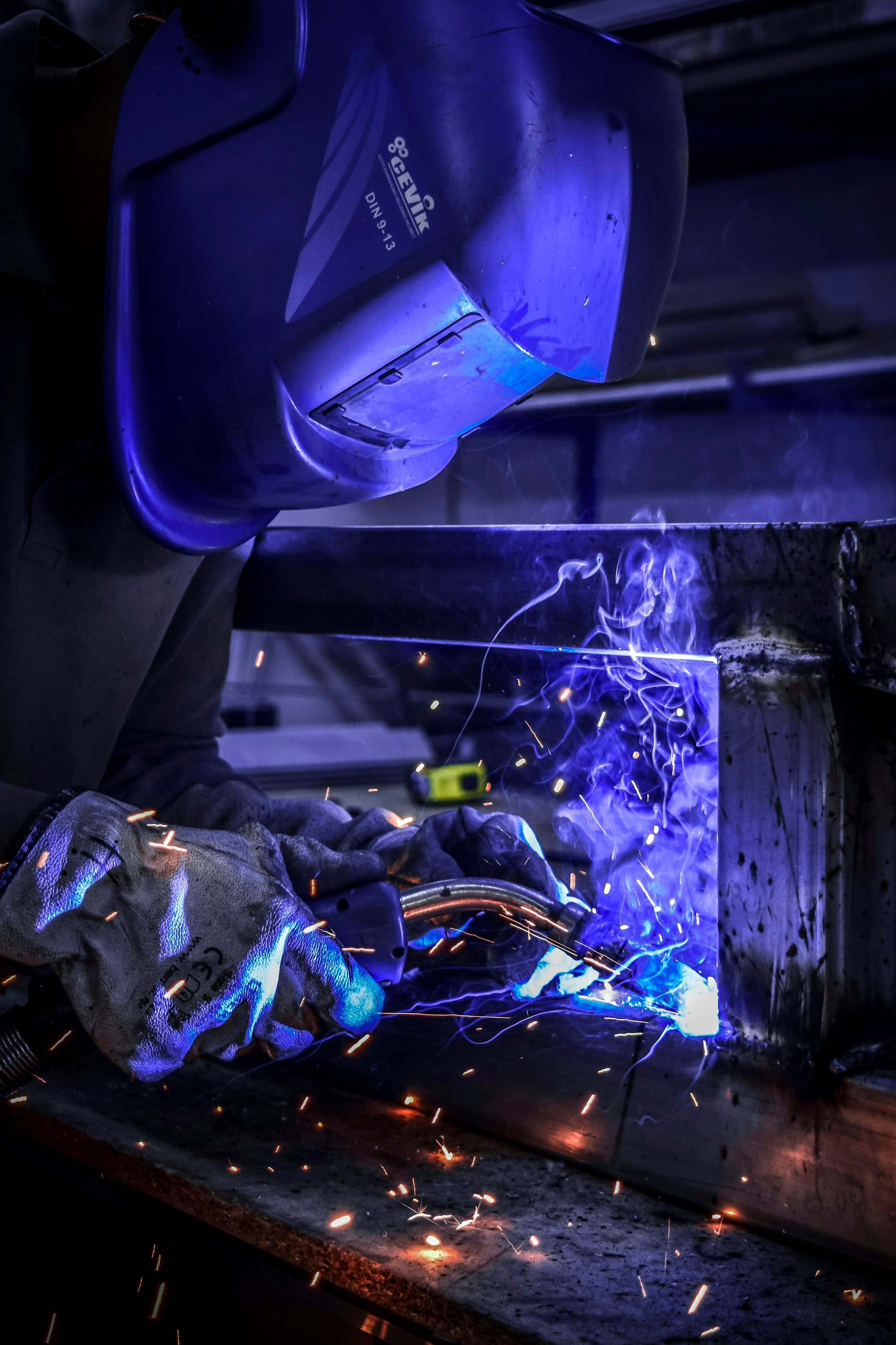 Structural steel fabrication with welding sparks