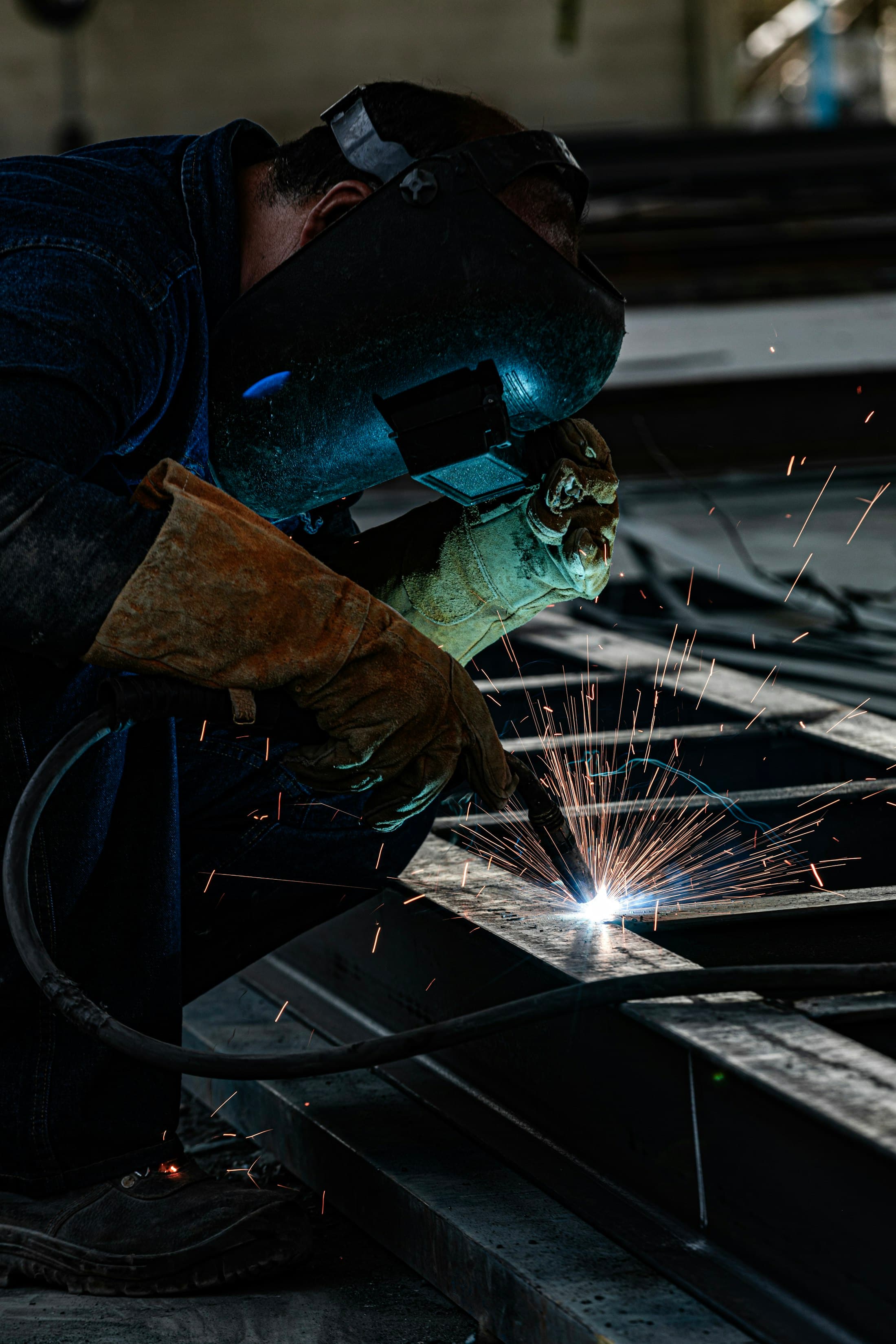 Structural steel fabrication with welding sparks
