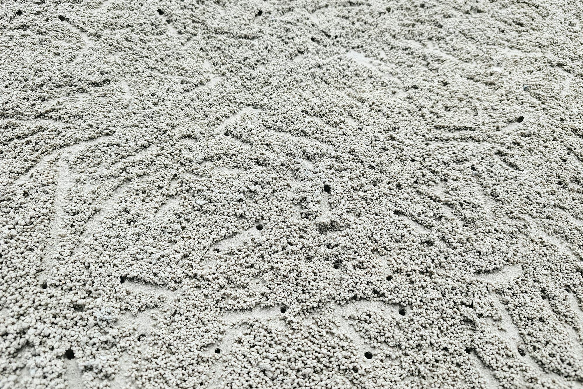 Pale zircon sand grains close-up